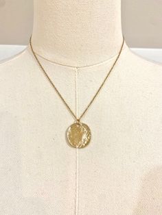 This beautiful 18k gold plated necklace can be worn as a statement piece or layered with other necklaces. Featuring a gold disc pendant, making for a perfect simplistic gold boho/beach style necklace.  ~Material~ High quality 18k gold plated stainless steel chain. ~Length~ 16 inches can be adjusted to 18 inches. M O R E * I N F O R M A T I O N ~Care instruction~ Please remove it before bathing or swimming. Avoid your jewelry touching chemicals such as hairsprays or perfumes. ~Shipping~ After rec Gold Pendant Necklace With Adjustable Chain, Tarnish Resistant Brass Necklace With Round Pendant, Gold-tone Gold Plated Charm Necklace With Round Pendant, Gold-tone Round Pendant Charm Necklace, Gold-tone Clavicle Chain Necklace With Round Pendant, Gold-tone Necklace With Delicate Chain And Round Pendant, Gold-tone Round Pendant Necklace, Gold Delicate Pendant Chain Necklace, Gold Pendant Chain Necklace With Delicate Chain