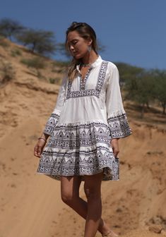 This gorgeous free size off white and black block print cotton smock Boho summer beach dress has a lovely clean crisp fresh and natural vibe. Its ultimate boho hippie fashion , sustainably clothing that's gentle on the skin and the environment. Its made from pure cotton. Each piece is individually hand printed with vegetable dye using the ancient and timeless technique of block printing for that lovely earthy mottled finish that feels so organic, wholesome and unique. A perfect go to cotton summ Printed Mini Boho Dress For Vacation, Black Cotton Tunic For Summer, Beach Smock Sundress In Mini Length, Beach Smock Sundress Mini Length, Beach Sundress With Smock Detail In Mini Length, Mini Smock Sundress For The Beach, Summer Cotton Smock Mini Dress, White Bohemian Printed Mini Dress, Bohemian White Printed Mini Dress