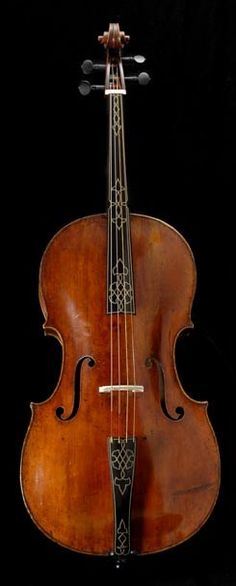 an old violin is shown against a black background