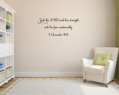 a room with a chair, bookcase and wall decal that says seek by lord and has brought such as his peace eventually