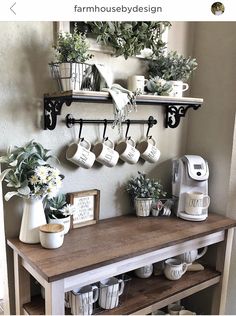 a shelf with coffee mugs and plants on it