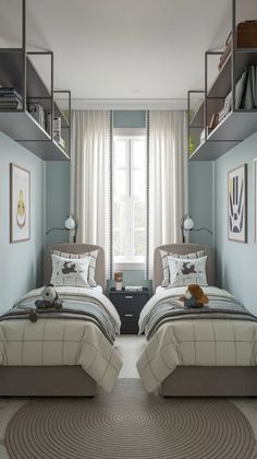 two twin beds in a bedroom with blue walls and carpeted flooring next to each other