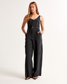 Elevate your wardrobe with the Abercrombie & Fitch Women's Draped Utility Jumpsuit, a perfect blend of style and functionality tailored for the modern woman. This jumpsuit is crafted from a luxurious mix of viscose and polyester, ensuring both comfort and durability.

- Size: M TALL
- Color: Black
- Material: Viscose, Polyester
- Gender: Female

Designed with a flattering scoop neckline and wide straps, this piece features an adjustable belt that cinches at the waist for a custom fit. The wide-l Female Features, Belt Wide, 2024 Wishlist, Utility Jumpsuit, Style Jumpsuit, Utility Style, Style Cargo, Jumpsuit Black, Black Xs