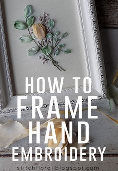 a frame with some flowers on it and the words how to frame hand embroidery written in white