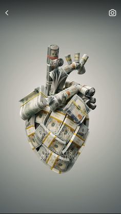 a heart made out of money on top of a gray background