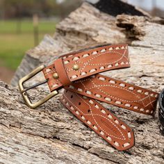 A classic leather belt is a closet staple for a reason, and our unisex version features embroidered western detailing and a buckstitch design. Built to be worn nine to five and five to last call, it’s just as cute with jeans as it is cinched around the waist of your favorite dress. Comes with Chicago screws and a brass buckle that can easily be switched out for your favorite statement-making buckle. Designed right here in the USA for cowgirls everywhere. Details: Composition: Leather with brass Buckstitch Leather Belt, Lane Frost, Nine To Five, Tooled Leather Belts, Chicago Screws, Brass Belt Buckles, Toddler Boots, Long Sleeve Kids, Boys Bottoms