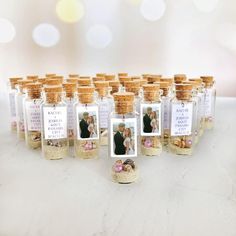 a table topped with lots of small bottles filled with different types of food and drinks