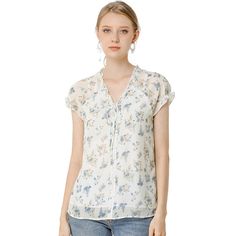 Lightweight and breezy, the shirt is perfect for sunshine styling. A floral print updates this top, perfect for adding a summer pattern to warm-weather looks. Made of a lightweight fabric, the printed style has a self-tie decor at the neckline and a ruffled trim. It has a loose fit that falls to the hip, so you can easily tuck it into skirts or jeans. Flowy Floral Print Top For Day Out, Trendy Ditsy Floral Print Top For Day Out, Casual Floral Print Relaxed Fit Blouse, Casual Relaxed Fit Floral Print Blouse, Spring Flowy Short Sleeve Blouse, Flowy Short Sleeve Blouse For Spring, Breezy Flowy Spring Top, Breezy Flowy Top For Spring, Breezy Spring Tops For Day Out