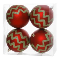 three red and gold christmas ornaments in a clear box with white border around the top