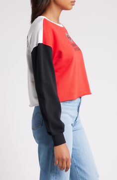 The Women's WEAR by Erin Andrews Heather Red Toronto Raptors Mixed Letter Cropped Pullover Sweatshirt is the perfect way to show your support for the Toronto Raptors. This midweight sweatshirt is made from a soft cotton and polyester blend, making it comfortable to wear all day long. The cropped, unfinished hem and embroidered graphics give it a stylish look that will turn heads. Whether you're cheering on the Raptors at the game or just hanging out at home, this sweatshirt is sure to become a f Trendy Red Cotton Sweatshirt, Red Color Block Tops For Streetwear, Sporty Red Color Block Top, Trendy Red Cotton Sweater, Red Sporty Color Block Top, Red Crew Neck Top For College, Red Winter Tops For College, Red Tops For Fall Streetwear, Red Color Block Long Sleeve Top