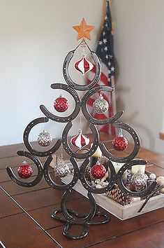 a christmas tree made out of ornaments on a table