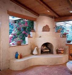 an outdoor fireplace in the middle of a kitchen