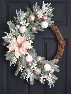 a christmas wreath hanging on the front door