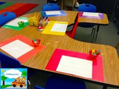 a classroom with several desks and chairs covered in colorful sheets of paper on top of them