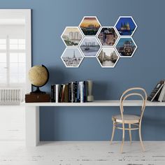 a chair sitting in front of a table with books on it next to a book shelf