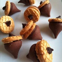 some cookies and pastries are arranged in the shape of star wars characters on a white surface