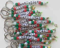 a bunch of key chains that have been made to look like christmas letters