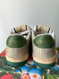 Authentic Gucci Screener Sneakers in excellent condition. Worn once but they don't fit me, sadly. Size 37, fit like a US 7.5. Classic Gucci sneakers featuring the Gucci stripes and classic green sole with bee design. Made in Italy. Please note: this style has some intentional distressing. Approximate measurements.Heel to toe: 10.5"Width: 3.75" Green Sneakers With Embroidered Logo And Round Toe, Green Round Toe Sneakers With Embroidered Logo, Designer Green Lace-up Sneakers, Luxury Green Low-top Sneakers, Designer Green Low-top Custom Sneakers, Green Luxury Low-top Custom Sneakers, Gucci Screener Sneakers, Gucci Screener, Gucci Sneakers