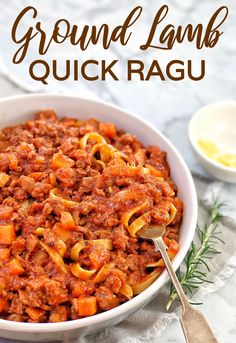 a close up of a bowl of ground lamb quick ragu with a spoon in it