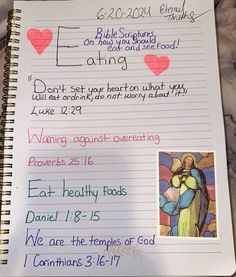 a note with pictures of jesus and mary on it next to a handwritten prayer