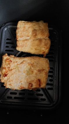 two pieces of food sitting on top of a grill