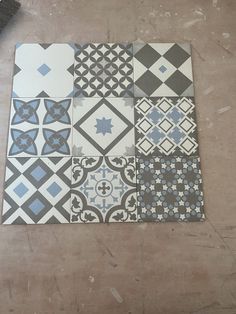 a tile floor with different patterns on it