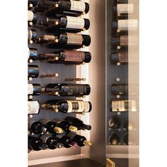 a wine rack filled with lots of bottles