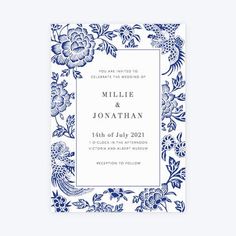 a blue and white wedding card with flowers on the front, in an ornate frame