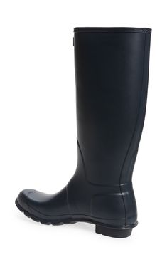 A classic finish perfects a puddle-proof rubber boot finished with a traction-gripping sole. Subtle tonal motifs circle the shaft, while an adjustable buckle at the side adds interest. Waterproof: protects against rain, puddles and slush to keep feet dry in wet conditions 1 1/2" heel height (size 9) 16" boot shaft height; 15 1/2" calf circumference In hot or humid weather, natural latex rubber releases a protective wax film; simply wipe it off with a damp cloth A pristine finish and shine is eas Classic Round Toe Boots For Rainy Weather, Classic Waterproof Rain Boots With Round Toe, Classic Waterproof Rain Boots, Classic Waterproof Rain Boots For Rainy Weather, Rain Boots Women, Humid Weather, Rubber Boot, Rain Boot, Natural Latex