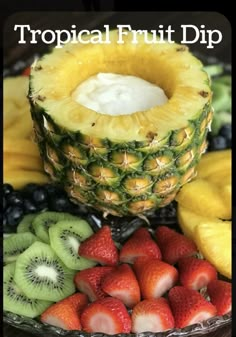 tropical fruit dip with strawberries, kiwis, and bananas on a plate