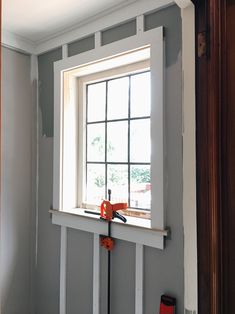 a window is being installed in the corner of a room