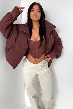 Keepin' you cozy this winter! The Ajax Puffer offers a super soft and comfy puffer material, long sleeves with cuffed ribbed ends, a high neck collar, zip up front and two front pockets. Style her with a pair of flares and a basic black crop. FABRICATION: 100% Polyester SIZING: Crystal wears a size AU XS. Winter Nylon Outerwear With Zip Cuffs, Cold Weather Solid Puffer Jacket With Padded Collar, Winter Puffer Jacket With Padded Collar And Long Sleeves, Solid Puffer Jacket With Padded Collar For Cold Weather, Cozy Puffer Jacket With Pockets For Winter, Cozy Puffer Jacket For Cold Weather With Pockets, Cozy Winter Puffer Jacket With Pockets, Trendy Fall Puffer Jacket For Cold Weather, Cozy Long Sleeve Puffer Jacket With Pockets