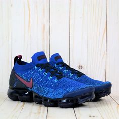 The Nike Air Vapormax Flyknit 2 “Gym Blue” Is A Bold New Colorway Of The Popular Style. Nike Outfits The Foot-Hugging Flyknit Upper With A Mix Of Sporty Royal Blue And Aqua Blue Colors, And Deep Red Subtly Accents The Nike Swoosh, Tongue, And Heel Tab. The Nike Air Vapormax Flyknit 2 Sneaker Utilizes The Latest Max Air Innovation With A Futuristic Vapormax Unit In Dark Blue Underfoot. Dual-Density Foam Sole And Large Max Air Heel Units Deliver Plush Cushioning For Casual, Everyday Comfort. Blue Sneakers With Gel Cushioning For Light Sports, Blue Mesh Running Shoes With Boost Midsole, Blue Mesh Sneakers With Gel Cushioning, Sporty Blue Mesh Running Shoes, Blue Mesh Sneakers With Air Max Cushioning, Blue Mesh Air Max Cushioned Sneakers, Blue Dynamic Running Shoes With Air Max Cushioning, Blue Sneakers With Air Cushioning Athletic Fit, Blue Sneakers With Gel Cushioning And Athletic Fit