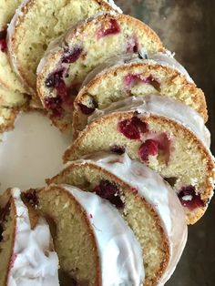 a cake with white frosting and cranberry toppings