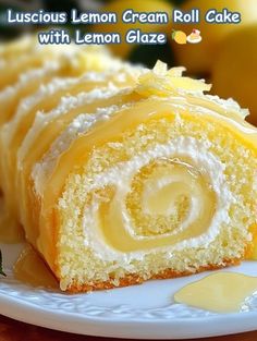 a lemon cream roll cake on a white plate