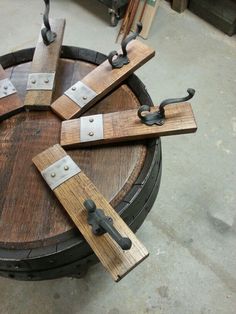 several pieces of wood sitting on top of a barrel