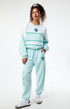 PacSun exclusive! Get ready to lounge in style with the Malibu LA Sports Club Sweatpants from Barbie. These sweatpants feature an interior drawstring waistband and side hand pockets for added convenience. Finished with Barbie embroidery and elastic ankle cuffs, they offer both comfort and a touch of sporty chic.


	Solid color sweatpants
	Soft fleece lining
	11.75" rise
	29.5" inseam
	10" leg opening
	High-rise
	Interior drawstring waistband
	Side hand pockets
	Barbie embroidery
	Elastic ankle cuffs
	60% cotton, 40% polyester
	Machine washable
	Model is wearing a size small
	Model measurements: 5’6” height, 30” bust, 25.5” waist, 36.5” hip Pink Athleisure Sweatpants With Ribbed Cuffs, Sporty Pink Sweatpants With Ribbed Cuffs, Blue Sporty Sweatpants, Barbie Embroidery, Barbie Sweatpants, Pink Cotton Sporty Sweatpants, Bershka Outfit, Barbie Malibu, Sports Club