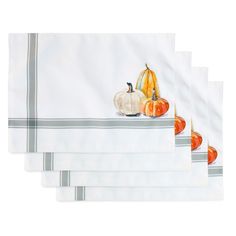 five place mats with pumpkins and gourds in them on a white background