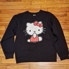 Sanrio Hello Kitty Thick Black Sweatshirt. Never Worn In Great Condition. Pet And Smoke-Free Home. Don't Be Afraid To Ask Any Questions Or Make An Offer. Black Cotton Sweatshirt With Cartoon Print, Black Cotton Sweatshirt With Character Print, Black Relaxed Fit Tops With Cat Design, Black Relaxed Fit Top With Cat Design, Hello Kitty Print Crew Neck Cotton Sweatshirt, Cotton Crew Neck Sweatshirt With Hello Kitty Print, Black Cotton Top With Cat Design, Casual Hello Kitty Sweatshirt For Streetwear, Casual Hello Kitty Print Crew Neck Sweatshirt