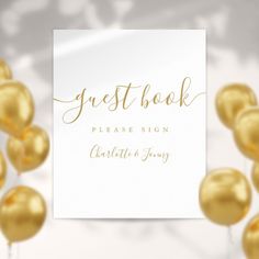 a white sign that says guest book with gold balloons in front of it and the words please sign above it