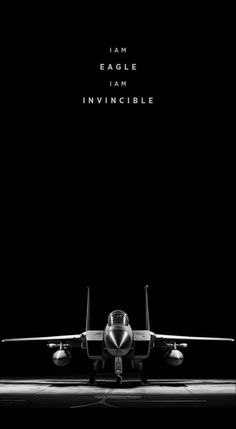 a black and white photo of an airplane with the words eagle i am invincible above it