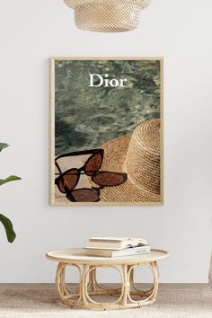 a poster with the word dior on it in front of a table and chair