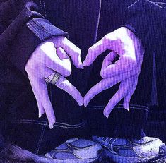 two hands in the shape of a heart on top of each other with their fingers together