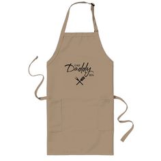 a tan apron with the words, chef daddy and two crossed knives in black on it