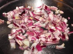 chopped onions are being cooked in a pan