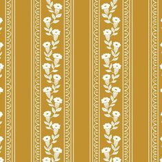 a yellow and white striped wallpaper with flowers on the side, in an ornate pattern