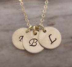 "I was watching the Real Housewives of New York and loved the necklace that Heather wears almost daily. I couldn't wait to come up with a version of my own! I made one for myself and have gotten so many compliments that I felt you might like one too. So here it is ~ three small 14K gold filled disks hand stamped with initials of your choice. They come hanging on a 14K gold filled cable chain. A classic everyday necklace to be worn alone or layered. This necklace includes: ~ Three Gold Filled Han Gold Monogram Necklace, Monogram Necklace Gold, Disk Necklace, Real Housewives Of New York, Initial Disc Necklace, Housewives Of New York, Family Necklace, Initial Necklace Gold