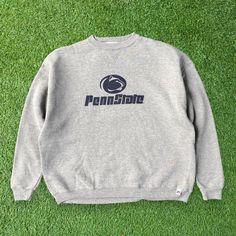 Show your school spirit with this Penn State Nittany Lions Gray Sweatshirt. Featuring a graphic of Pennsylvania State University, this crewneck sweatshirt is perfect for showing your support for the Nittany Lions. The gray color adds a versatile and classic touch to your outfit. Made with comfort in mind, this XL youth-sized pullover offers a cozy fit for young fans. Whether you're attending a game or simply want to represent your school, this Penn State Nittany Lions Gray Sweatshirt is a must-have addition to your collection. Embrace the pride of Pennsylvania State University and stay warm in style with this iconic crewneck pullover. 📏Measurement:📏 Size on Tag: XL Youth Width (Pit to Pit): 24" Length (Neck to end of garment): 24" Sleeve Length (Neck to end of cuff): 27.5" 👕Condition: G College Crew Sweater With Logo Print, Collegiate Crew Sweatshirt With Logo Print, College Logo Print Crew Neck Sweatshirt, Logo Print Sweatshirt For Campus In Fall, Collegiate Logo Print Sweatshirt For Fall, College Sports Season Sweatshirt With Logo Print, Collegiate Crew Neck Sweatshirt With Logo, College Fleece Sweatshirt With Logo Print, College Logo Print Sweatshirt For Fall