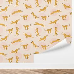 a wallpaper with gold cheetah and leopards on it, in an empty room