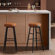 two stools in front of a bar with bottles and glasses on the counter top